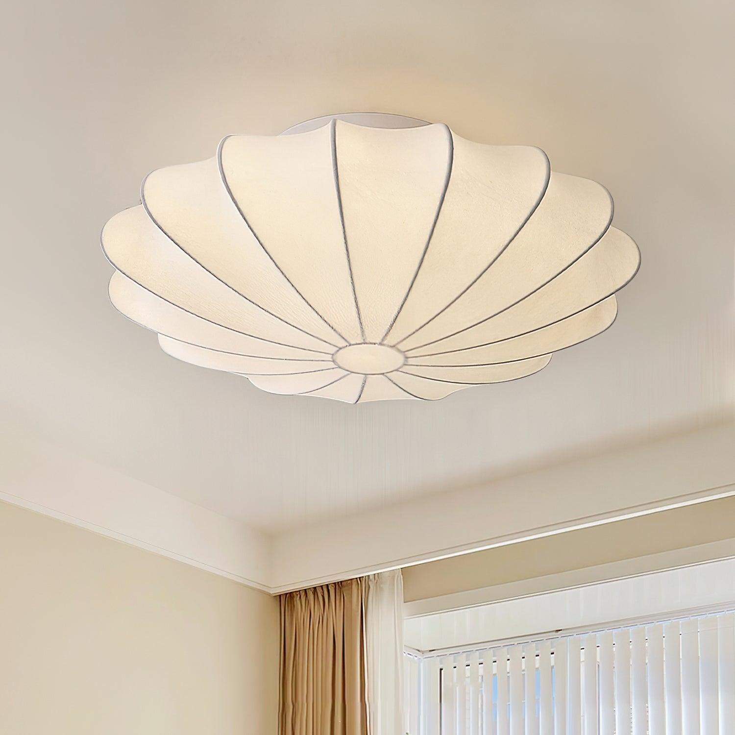 Nelson Bubble ceiling lamp with a silk cover over a steel wireframe casting a soft glow