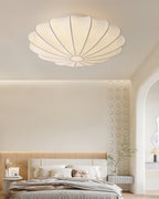 Nelson Bubble ceiling lamp shown lit, the silk diffusing warm ambient light