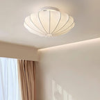 Nelson Bubble ceiling lamp shown lit, the silk diffusing warm ambient light