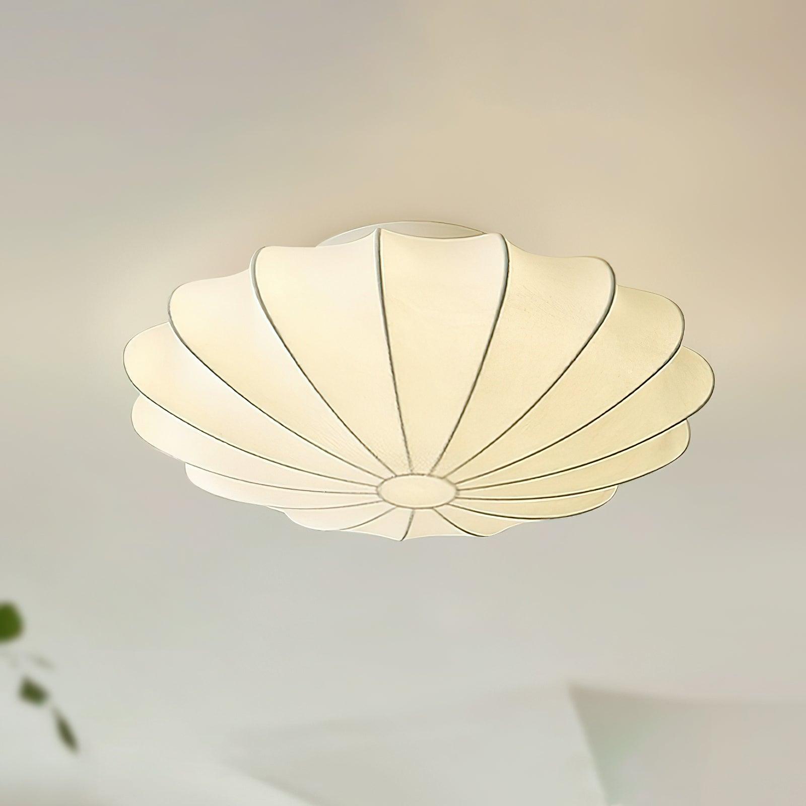 Nelson Bubble ceiling lamp over a dining setting giving off a warm refined light