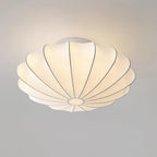 Nelson Bubble ceiling lamp with a silk cover over a steel wireframe casting a soft glow
