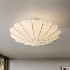 Nelson Bubble ceiling lamp with a silk cover over a steel wireframe casting a soft glow