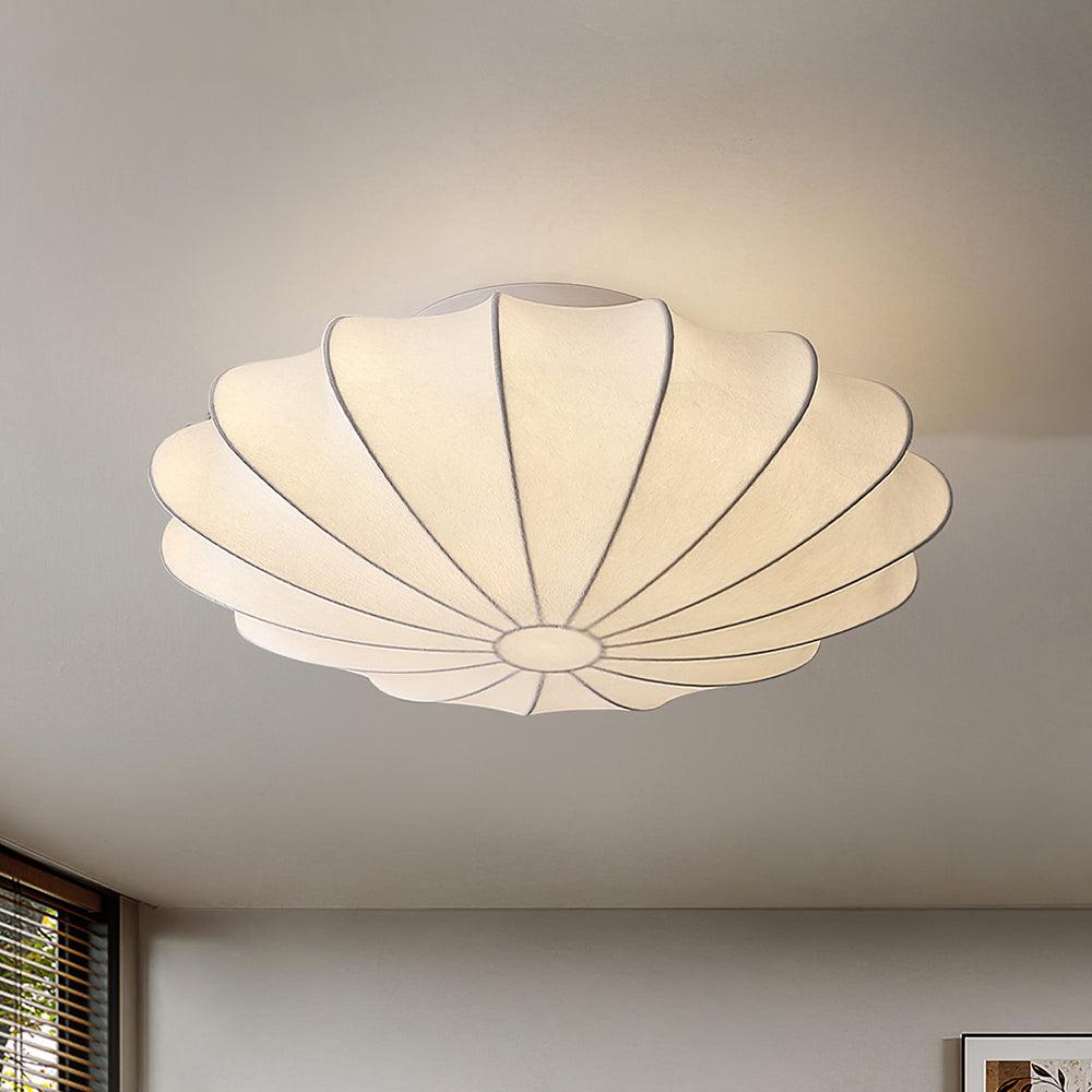 Nelson Bubble ceiling lamp with a silk cover over a steel wireframe casting a soft glow