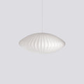 White mulberry silk bubble pendant light glowing above a dining table