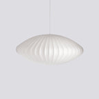 Silk bubble pendant light with soft criss-cross texture when lit