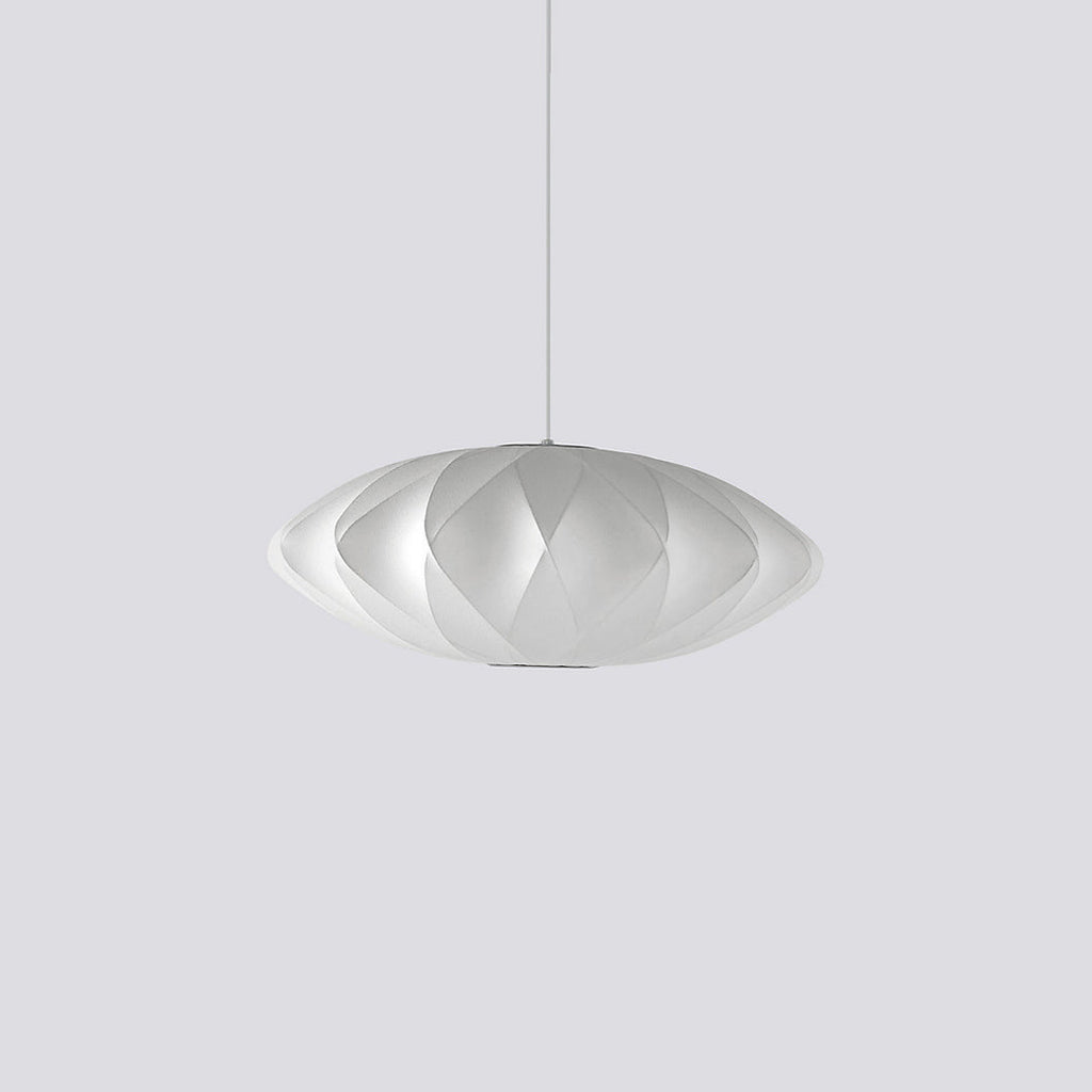 Rounded silk bubble pendant light glowing softly from the ceiling