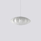 Rounded silk bubble pendant light glowing softly from the ceiling