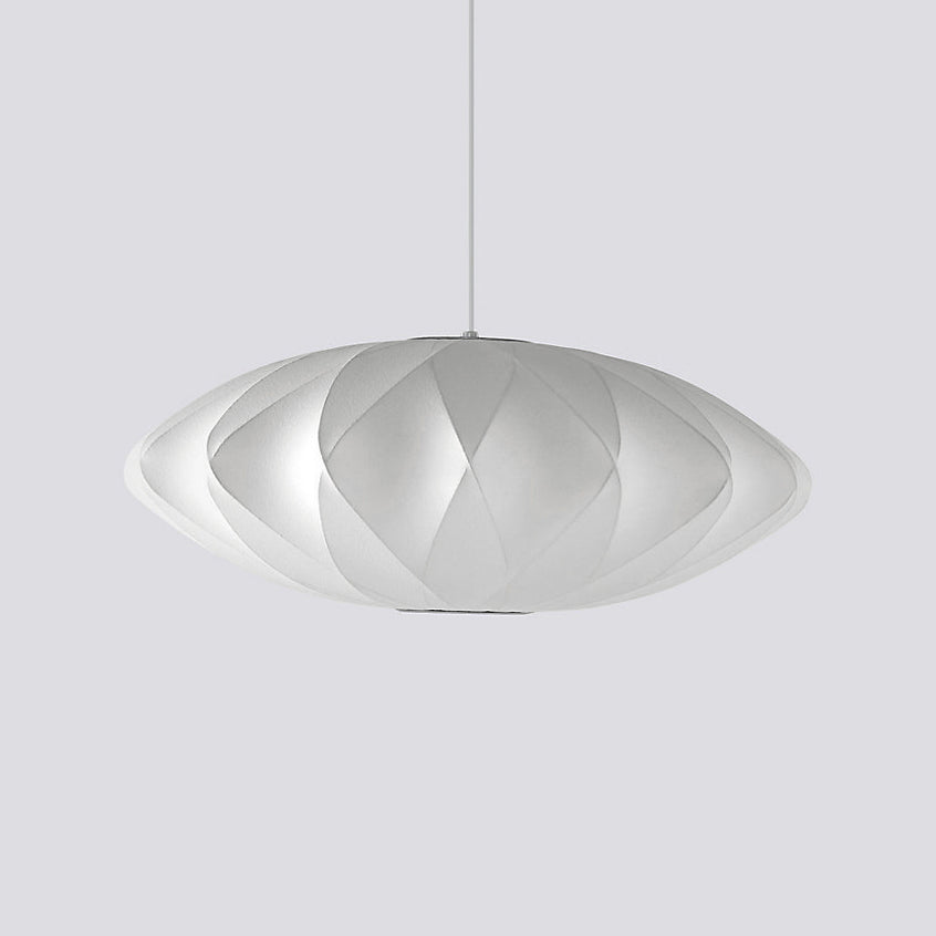 Rounded white bubble pendant light glowing in a calm interior
