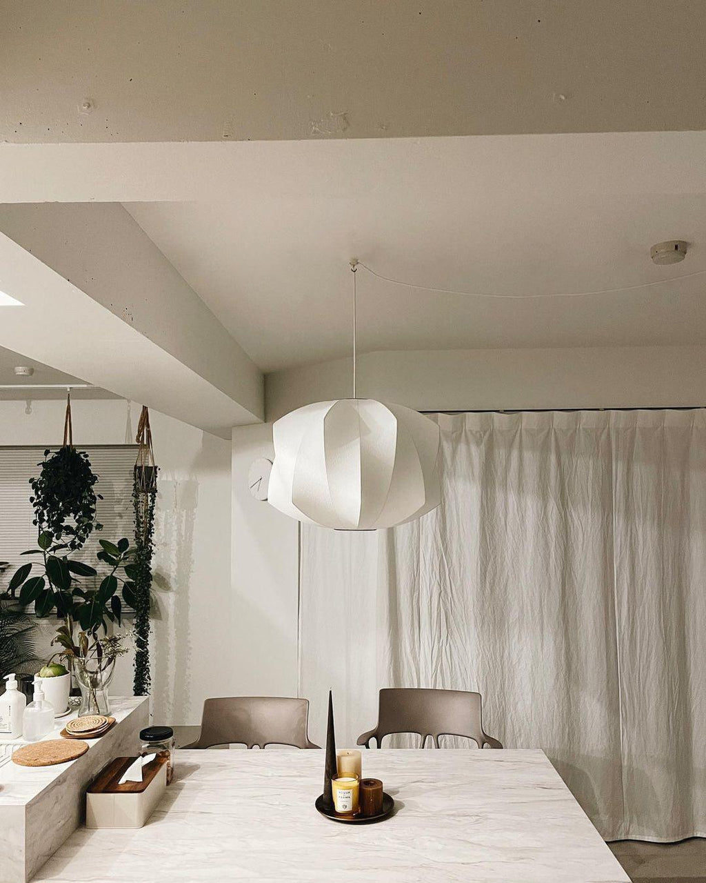 Nelson Bubble Swag Pendant Light hung in an interior setting