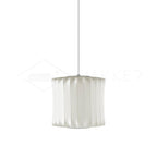 Lantern-shaped silk bubble pendant light glowing over a table