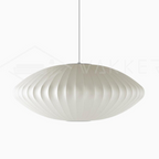 White saucer bubble pendant light shown on a plain background