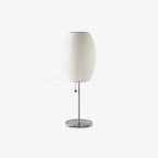 Faux silk bubble table lamp on a bedside table casting a soft diffused glow