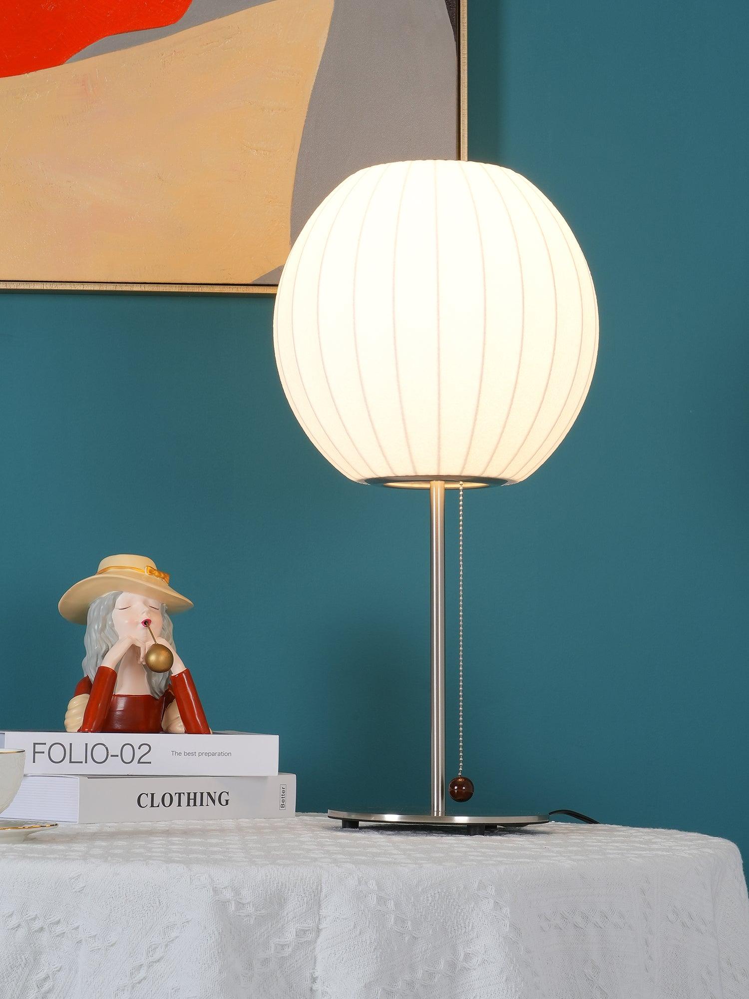 Faux silk bubble table lamp showing the pull-chain switch with wood accent