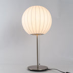 Close detail of the faux silk bubble shade's soft texture and curved form