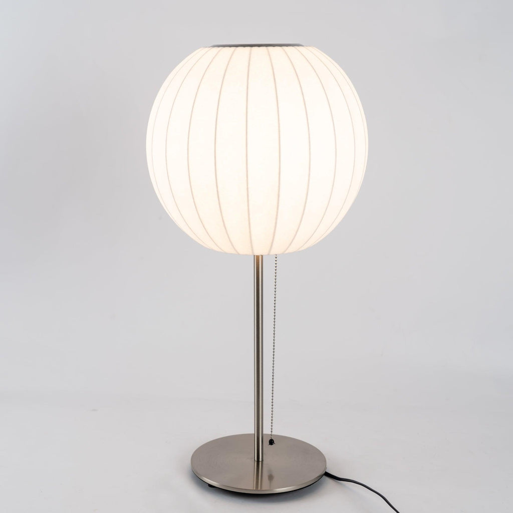 Side profile of the faux silk bubble table lamp and round chrome base