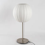 Faux silk bubble table lamp styled beside a sofa for warm ambient light