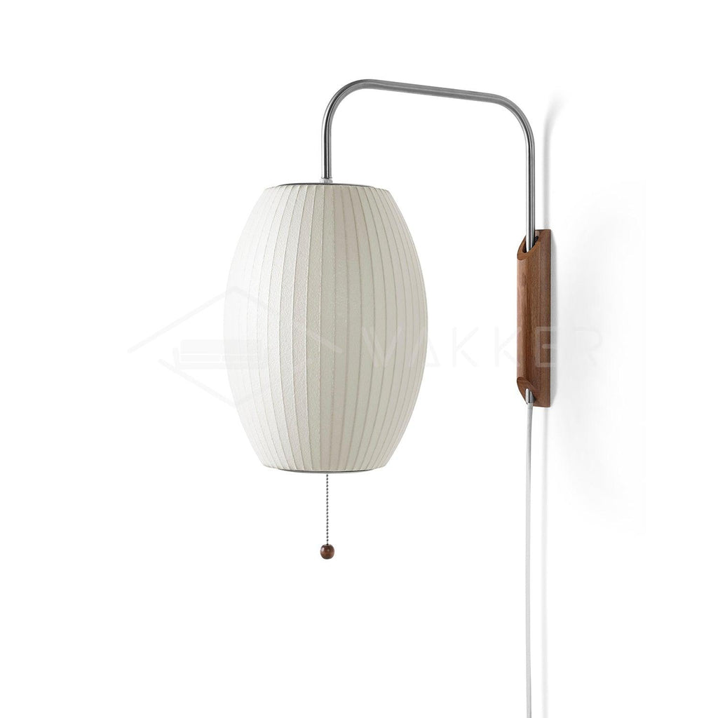 Spherical white wall sconce mounted on wall with walnut and chrome accents