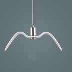 A white bird-shaped pendant from this Clérachic light hangs front-on with wings spread, its nickel neck catching the light against a dark blue-grey backdrop.