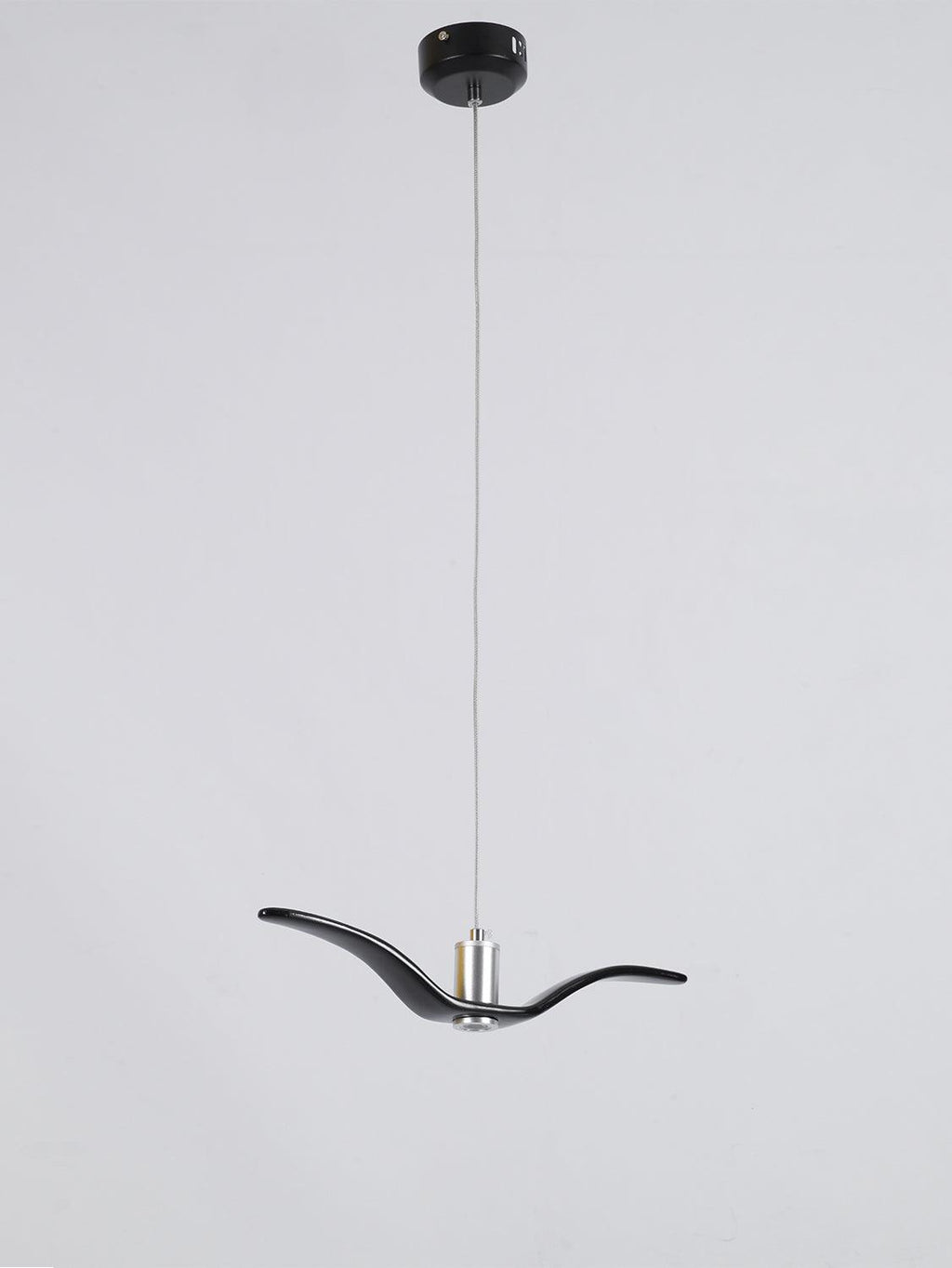 A black bird-shaped pendant from this Clérachic fixture hangs low from its black canopy, seen from a slightly different angle.