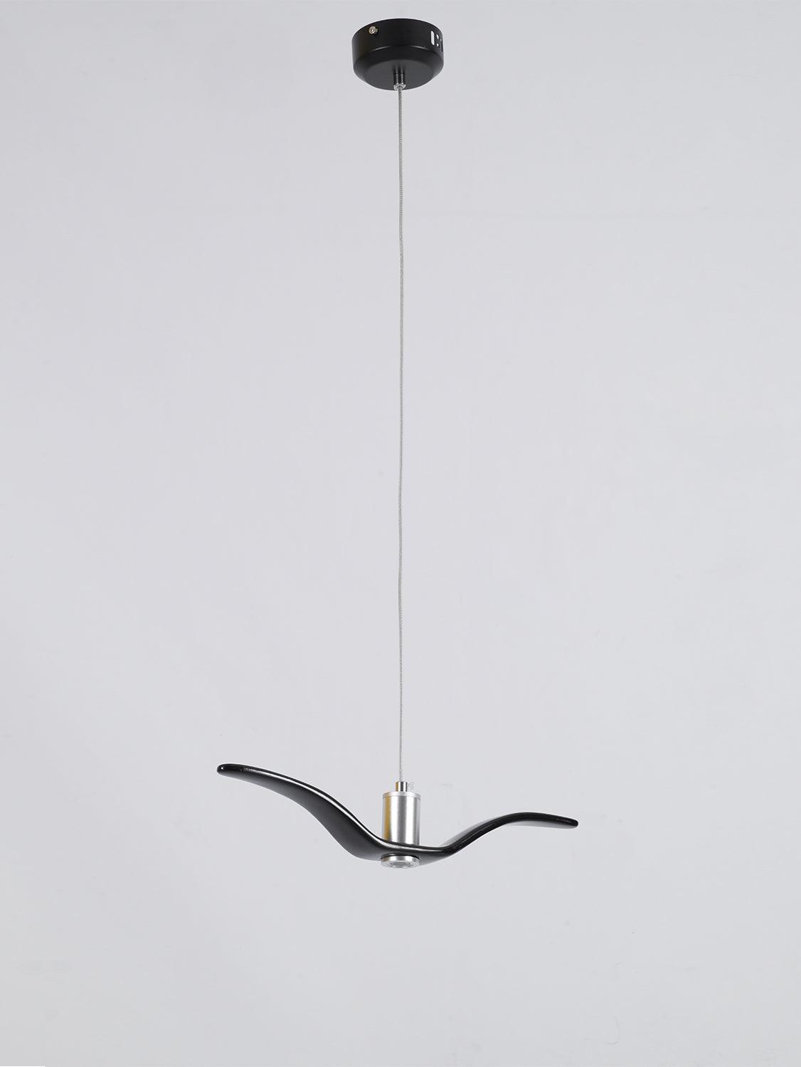 A black bird-shaped pendant from this Clérachic fixture hangs low from its black canopy, seen from a slightly different angle.
