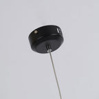 Close view of the black ceiling canopy and cable mount on this Clérachic pendant.
