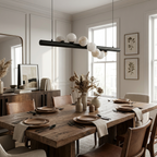 Above a wood table with brown leather chairs in a cream-walled dining room, this Clérachic pendant shows its matte black finish.