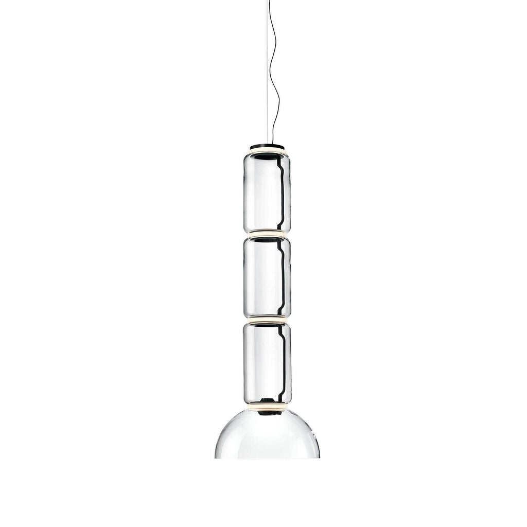 Studio shot of this Clérachic pendant with three glass cylinders above a dome-shaped shade.