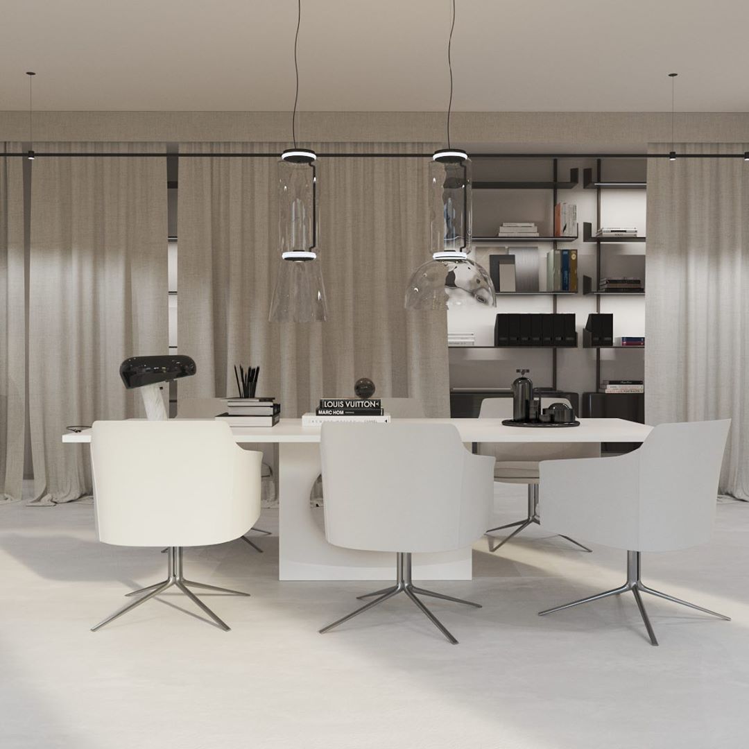 Two cylinder-shaded pendants from this Clérachic collection hang above a curtained table beside open bookshelves.