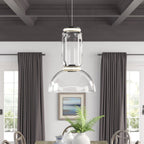 This Clérachic pendant's dome-shaped shade hangs above a dining table framed by grey curtains and a small painting.
