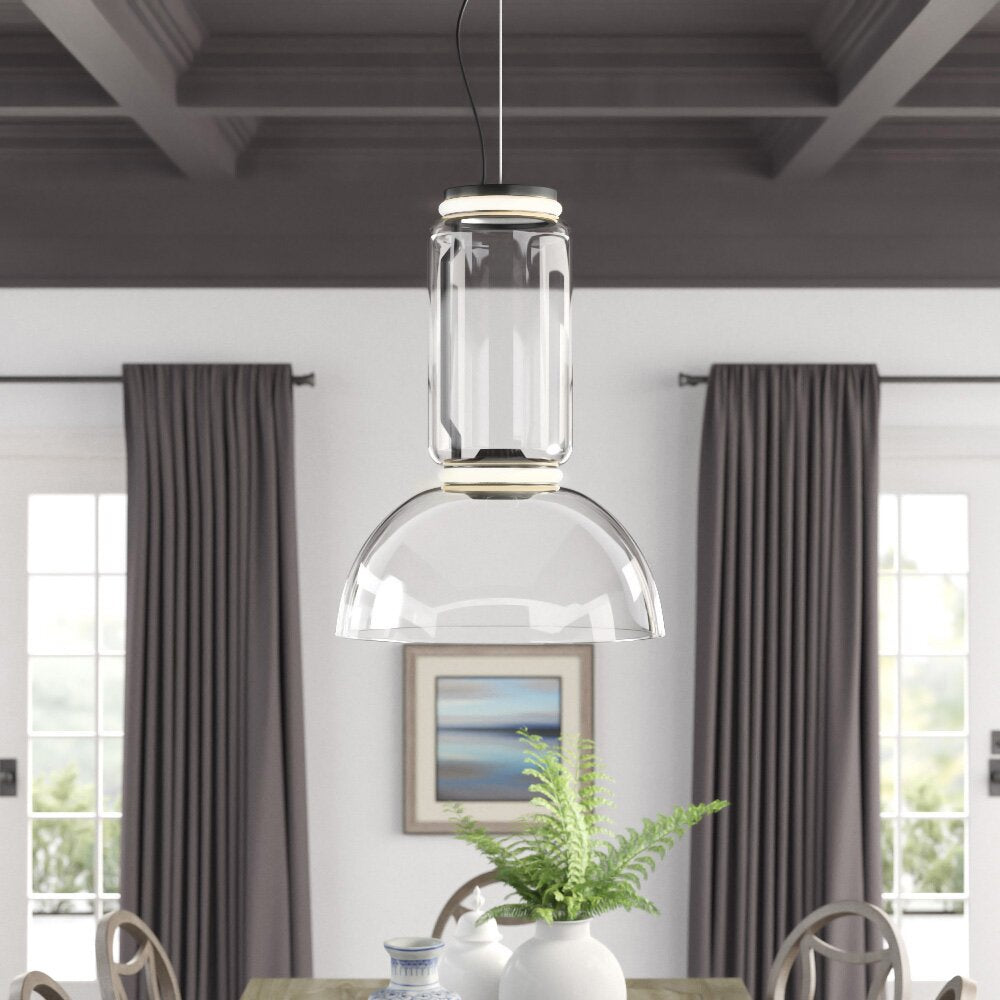 This Clérachic pendant's dome-shaped shade hangs above a dining table between grey curtains and framed art.