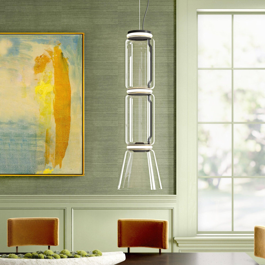 A three-tier version of this Clérachic pendant lights a green dining nook beside a tall window.