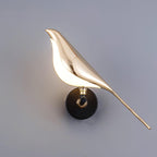 Close-up of the black and rose gold finish on the Nomi wall lamp
