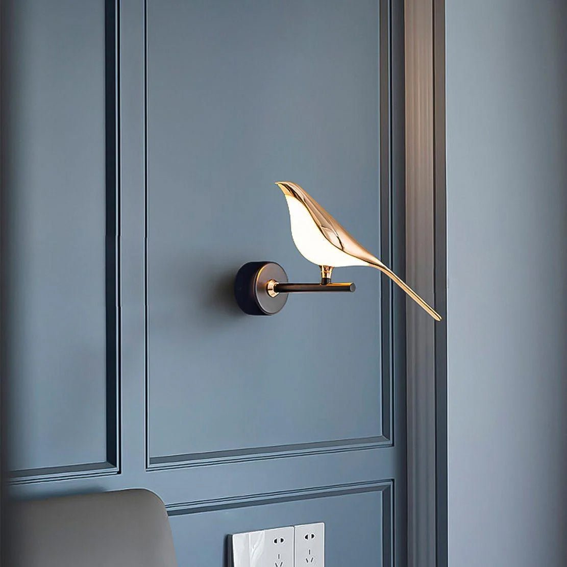 Nomi double-head wall lamp casting warm light on a wall