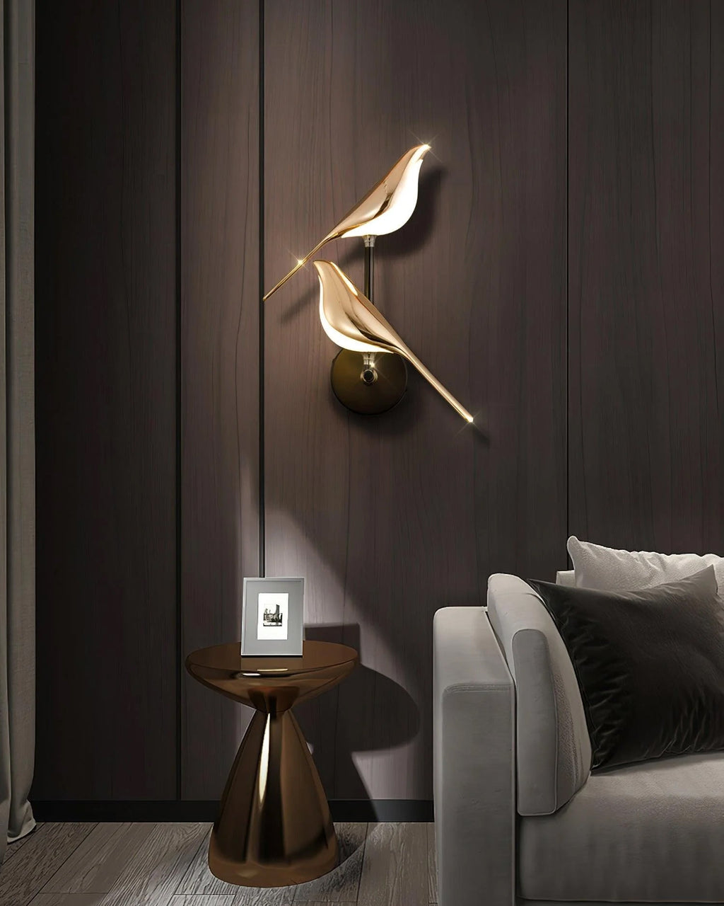 Nomi wall lamp single head glowing warmly against a neutral wall