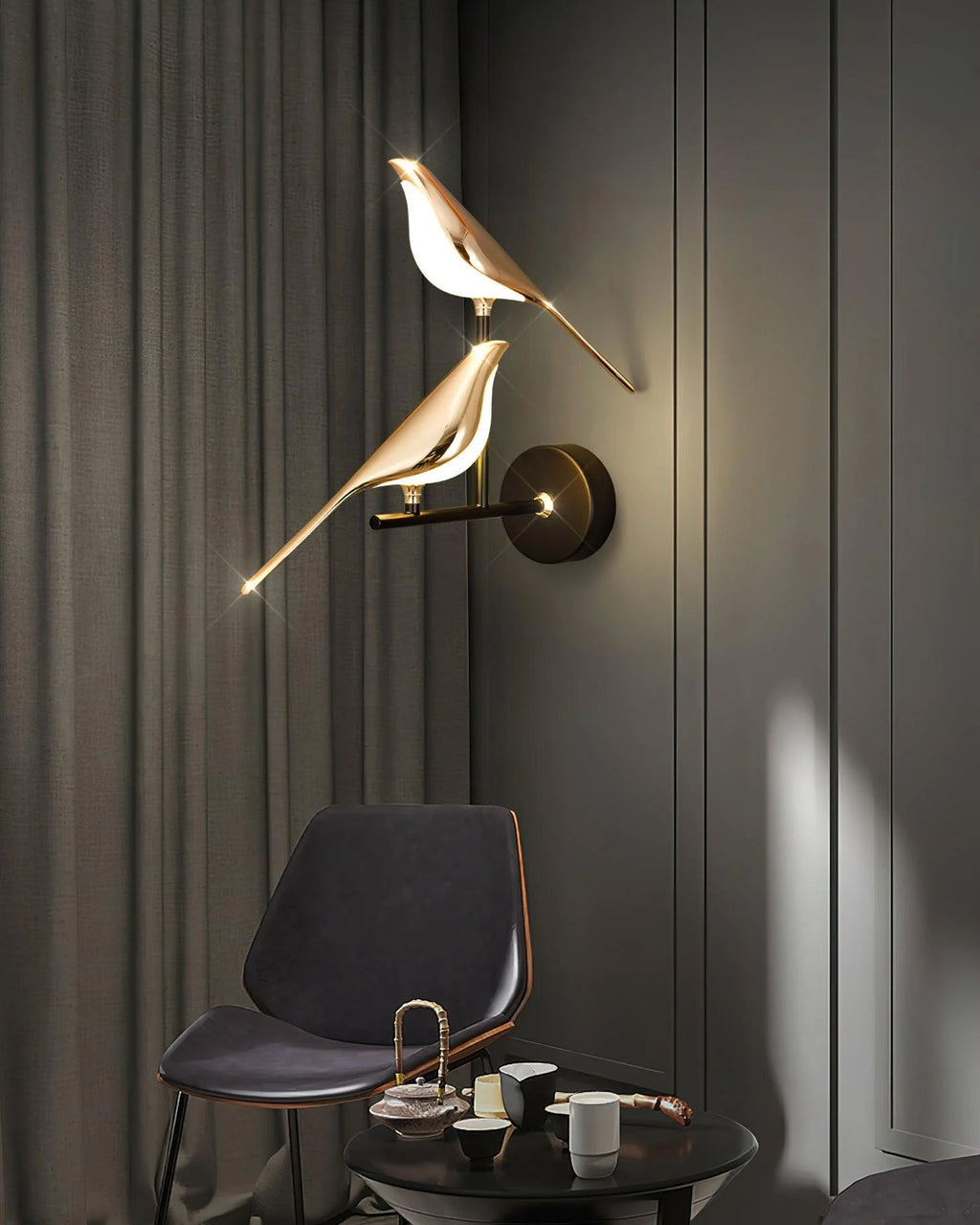 Bird-shaped Nomi wall lamp adjusted to direct light downward