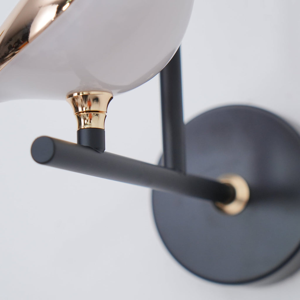 Bird-shaped Nomi wall lamp styled in a modern bedroom
