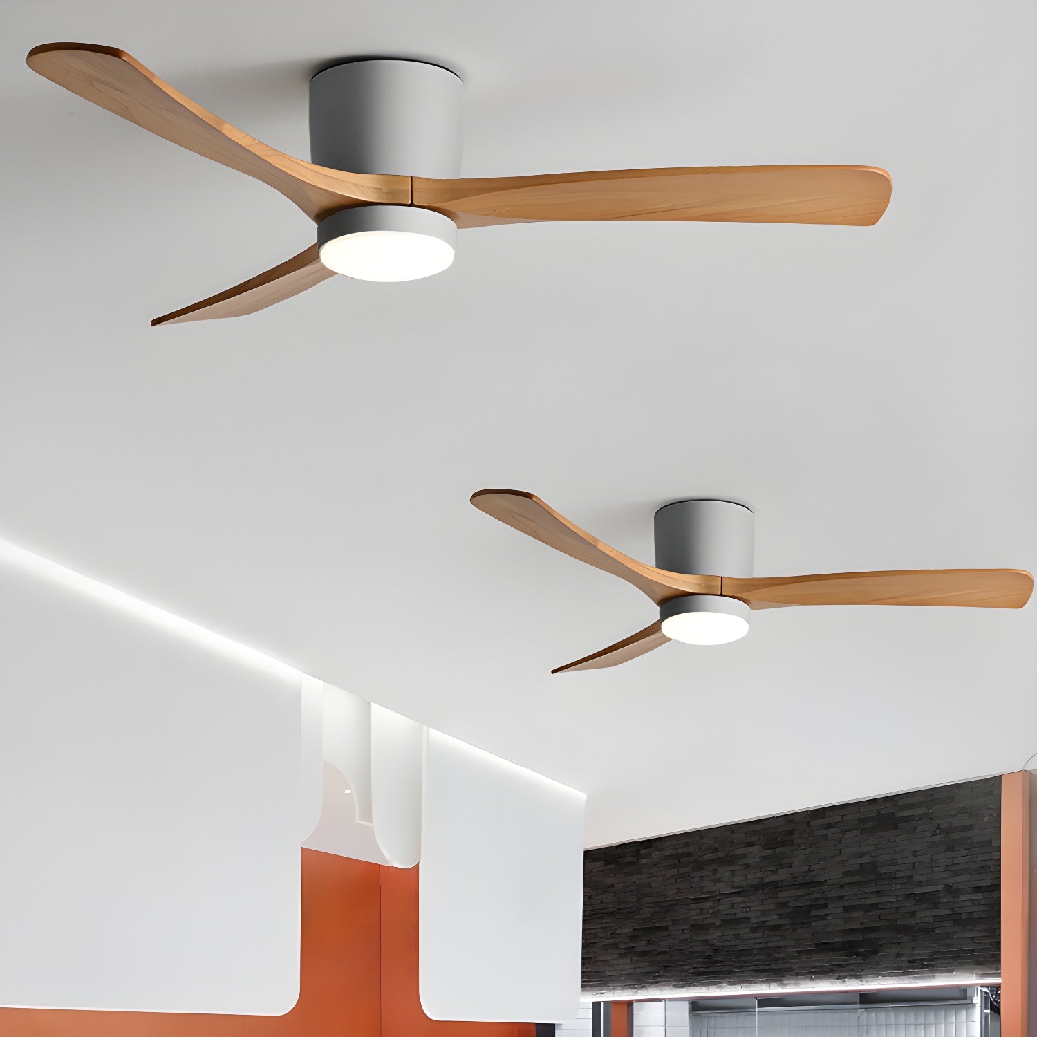 Wood-blade ceiling fan with warm LED light in a bedroom