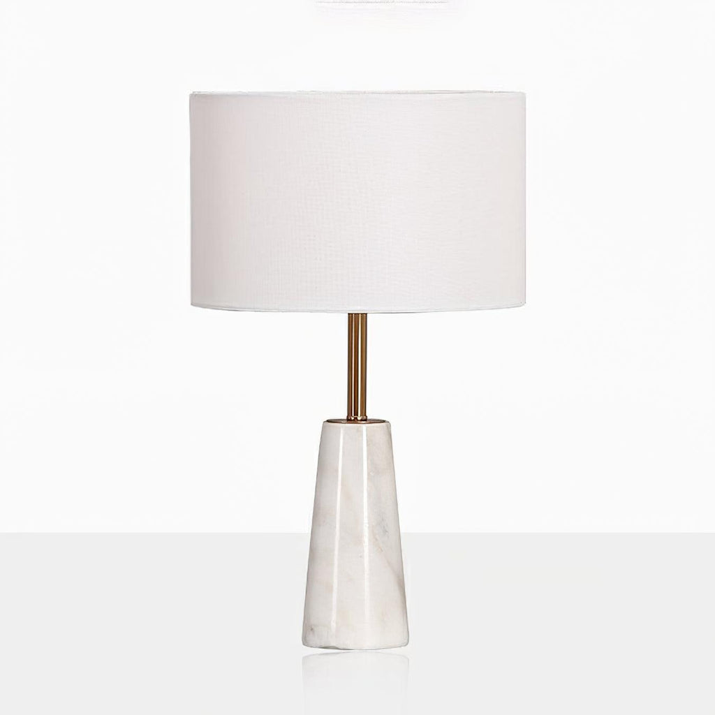 Clérachic table lamp shown full height on a reflective white surface, its faceted base doubled below it.