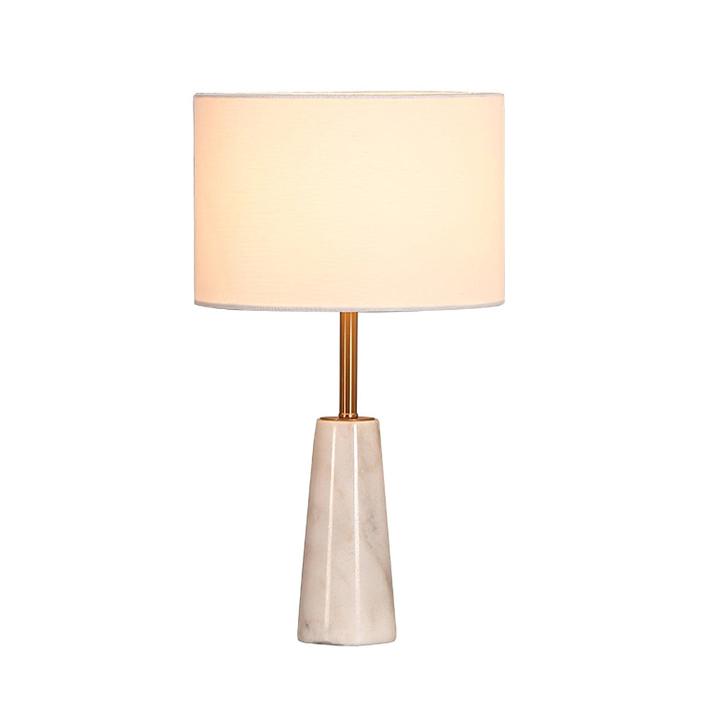 Clérachic table lamp glowing softly, centred against a plain white background with no visible reflection.