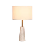 Clérachic table lamp glowing softly, centred against a plain white background with no visible reflection.