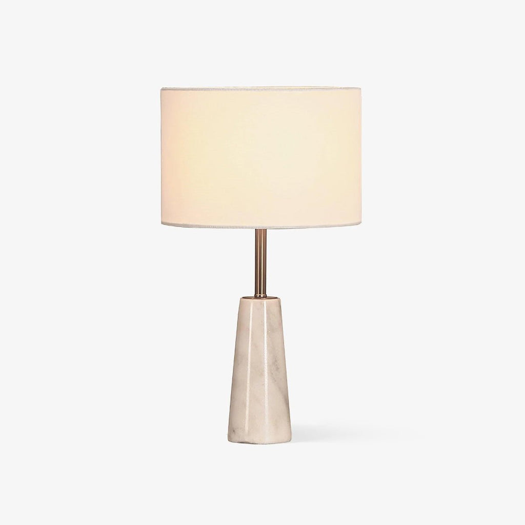 Clérachic table lamp with a white drum shade on a faceted marble base, photographed unlit against a plain white backdrop.