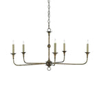 Candle chandelier hung over a styled dining table