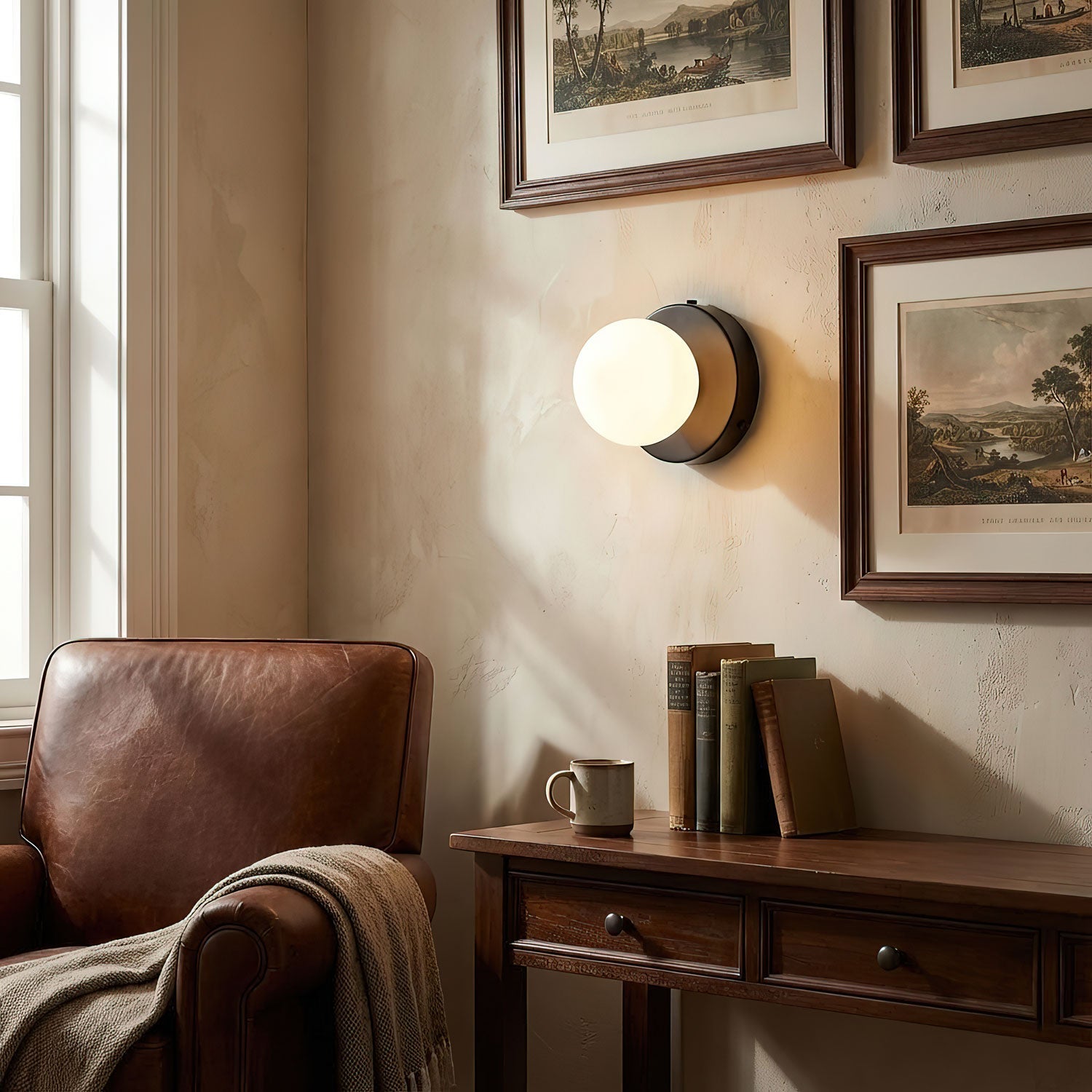 Nuvol wall lamp casting a soft glow in a quiet living space