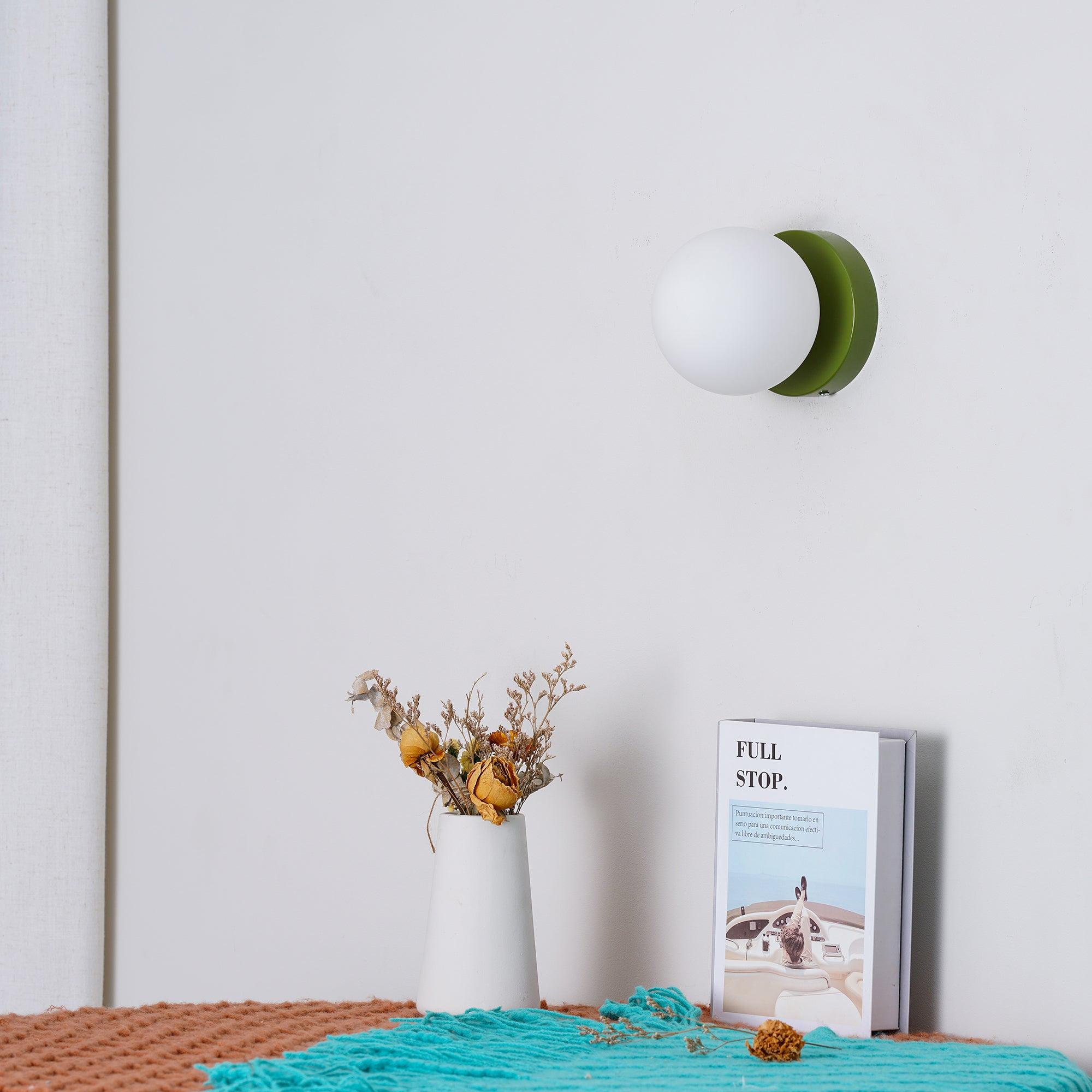 Nuvol glass globe wall lamp shown from the side
