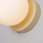 Nuvol compact wall lamp glowing softly in an evening interior