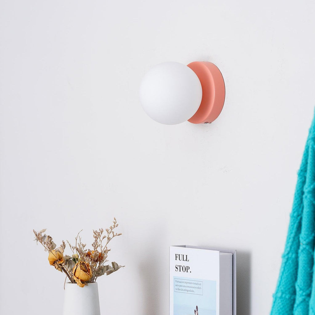 Nuvol wall lamp glowing warmly as a decorative accent