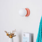 Nuvol wall lamp glowing warmly as a decorative accent