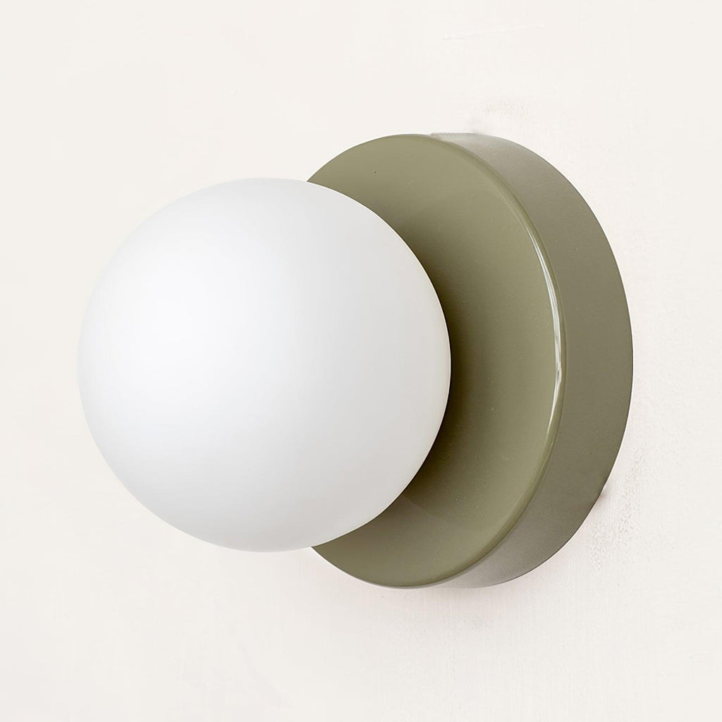Nuvol wall lamp adding warm accent light to a neutral wall