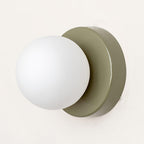 Nuvol wall lamp adding warm accent light to a neutral wall