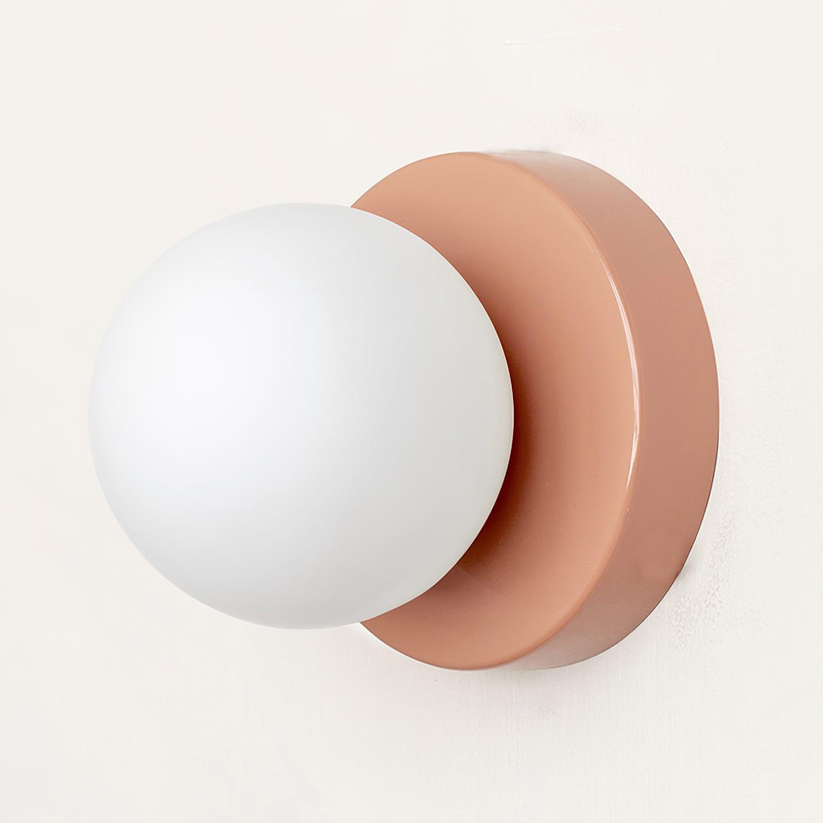 Nuvol wall lamp glowing warmly in a relaxed living space